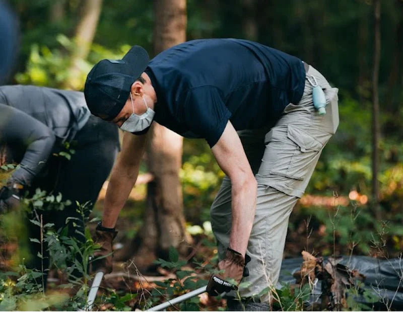 person working on a trail