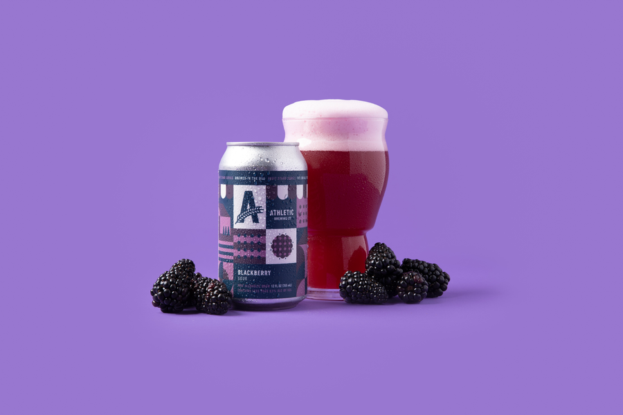 Blackberry Sour can and poured glass with fresh blackberries.