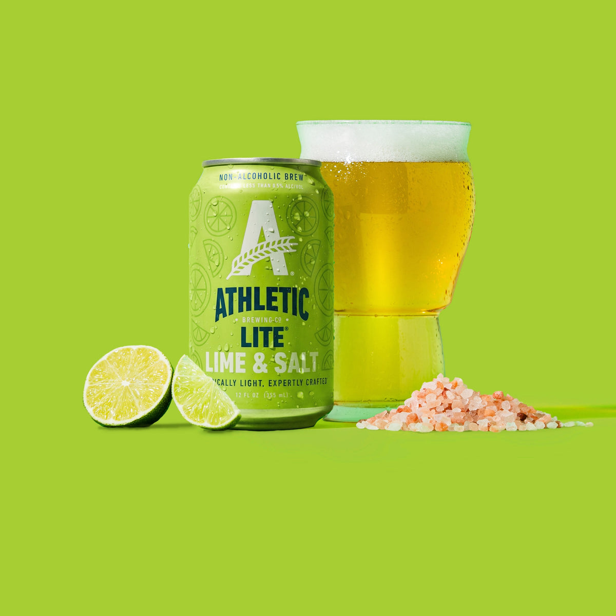Athletic lime & Salt can and a glass of na beer with lime and salt on the bottom