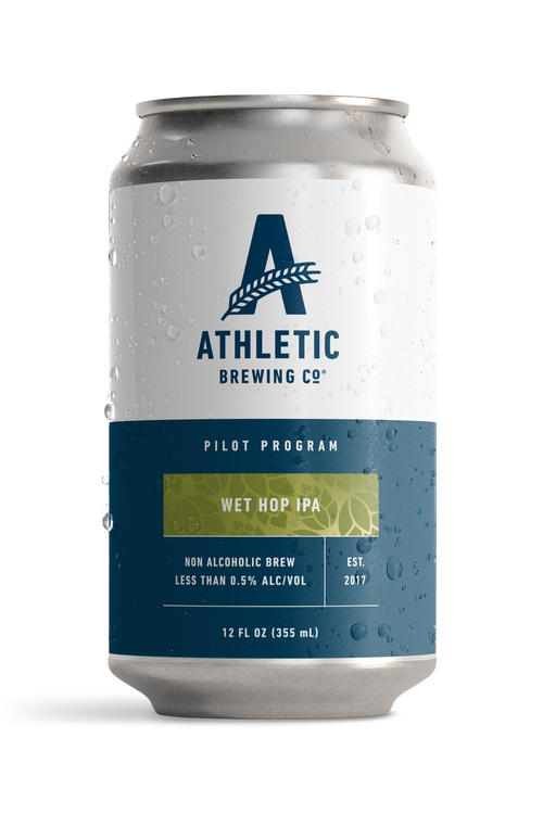 Athletic Brewing Company Pilot Program Wet Hop IPA non-alcoholic beer 12 oz can with a white and navy blue label, green Wet Hop IPA banner, and condensation droplets.
