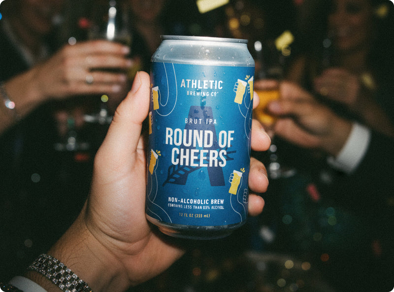 Round of Cheers can in hand